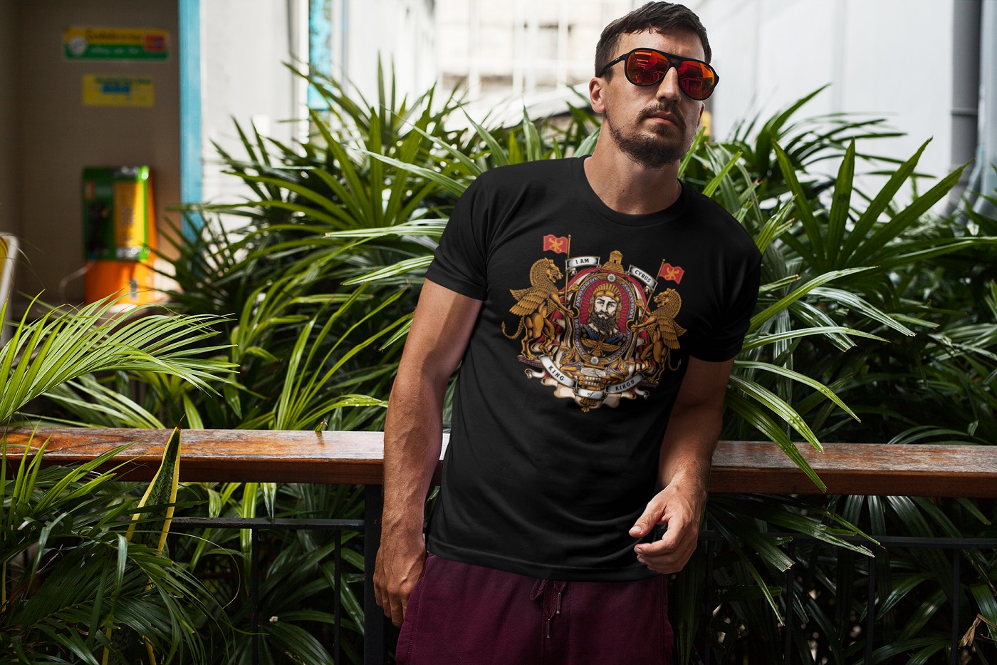 Man proudly wears the black 'I AM CYRUS' t-shirt by King Cyrus Clothing Company, representing Persian heritage and culture.